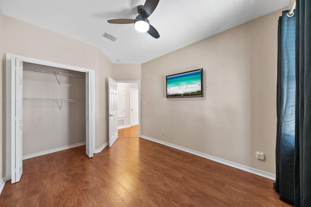 229 Inverrary Dr, Destin, FL 32541 - unfurnished bedroom with a ceiling fan, visible vents, wood finished floors, baseboards, and a closet