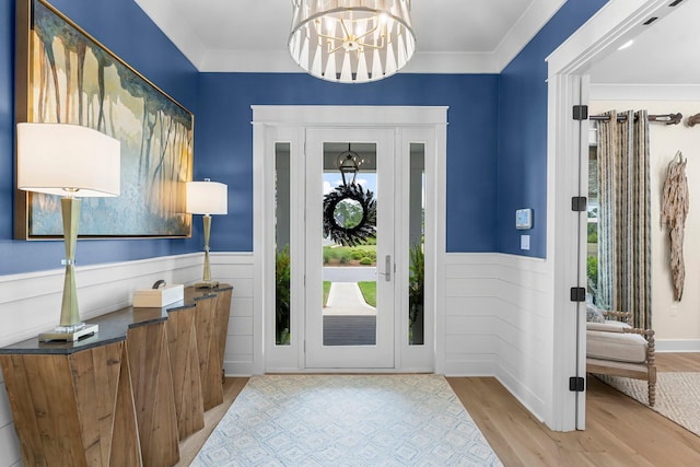 10 Basal St, Inlet Beach, FL 32461 - entryway featuring plenty of natural light, wainscoting, wood finished floors, a chandelier, and ornamental molding