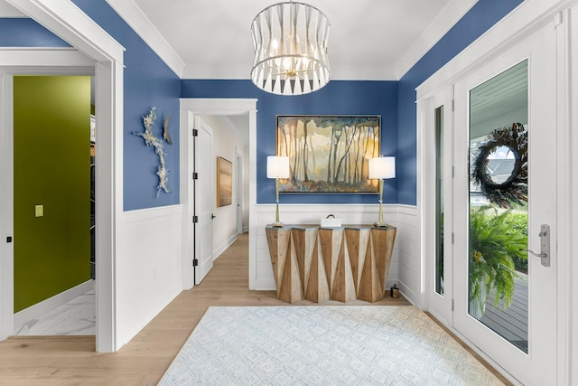 10 Basal St, Inlet Beach, FL 32461 - foyer with a wainscoted wall, wood finished floors, and a chandelier