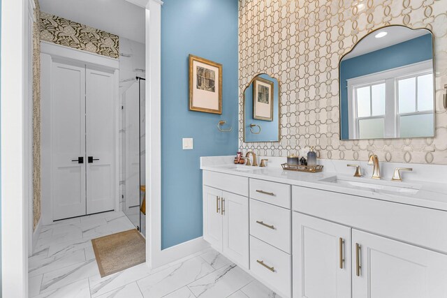 10 Basal St, Inlet Beach, FL 32461 - bathroom featuring baseboards, marble finish floors, double vanity, and a shower
