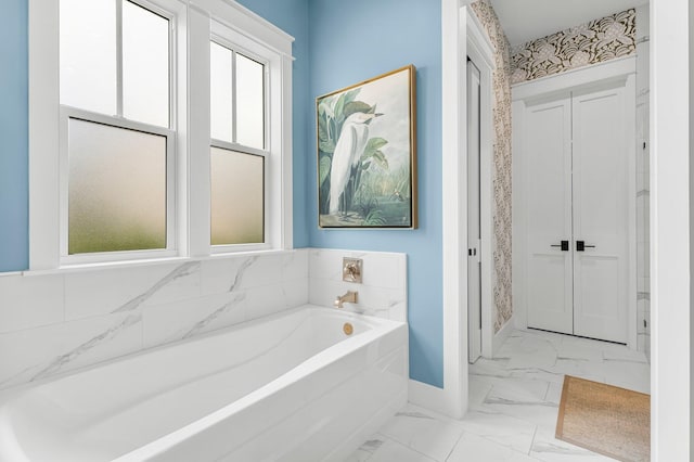 10 Basal St, Inlet Beach, FL 32461 - full bathroom featuring baseboards, marble look tiles, and a bath
