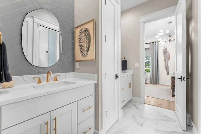 10 Basal St, Inlet Beach, FL 32461 - full bathroom with marble look tile flooring, baseboards, and vanity
