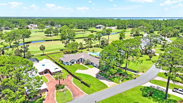 birds eye view of property with golf course view, a residential view, and a water view