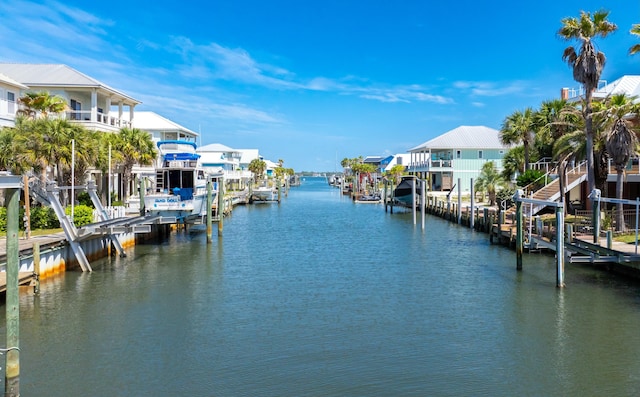 view of dock featuring boat lift and a water view