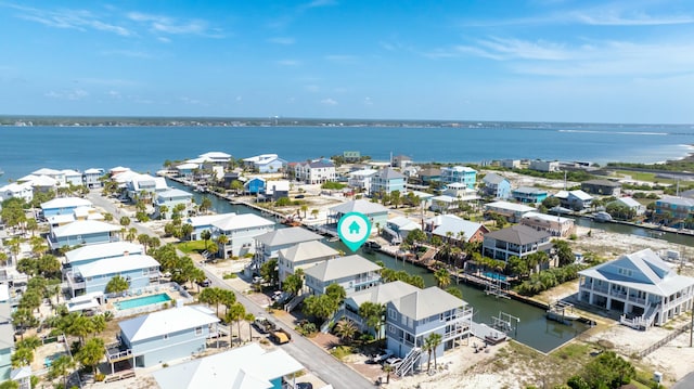 birds eye view of property with a residential view and a water view