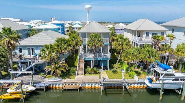 aerial view featuring a residential view and a water view