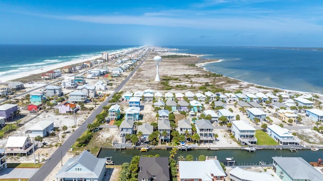 aerial view with a water view, a residential view, and a view of the beach