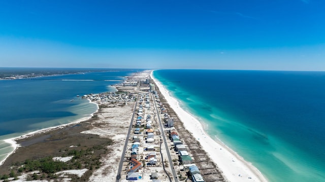 birds eye view of property with a beach view and a water view