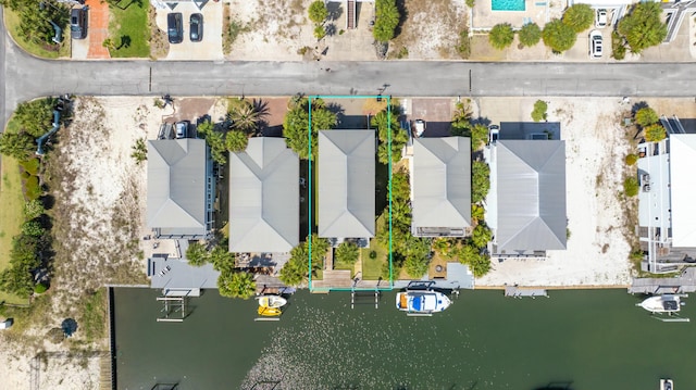 birds eye view of property featuring a residential view and a water view