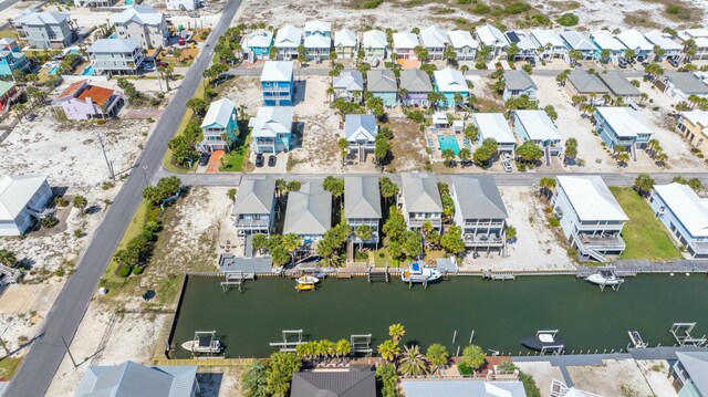 drone / aerial view featuring a residential view and a water view