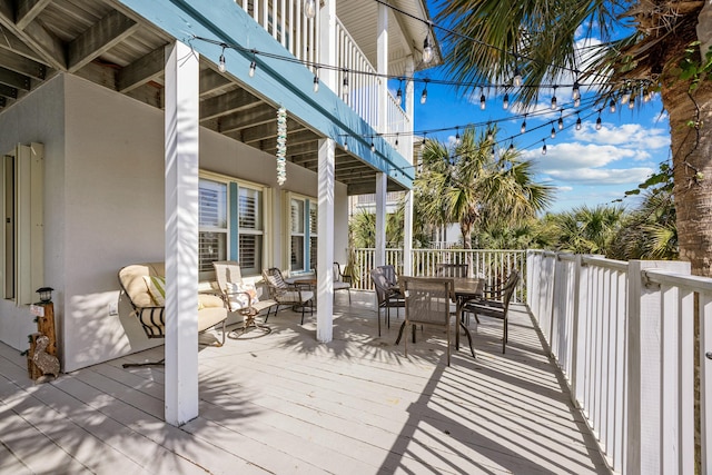 wooden deck featuring outdoor dining space