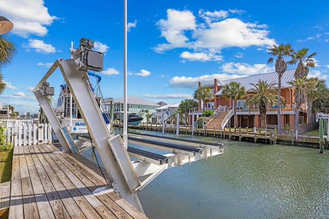 dock area featuring a water view and boat lift