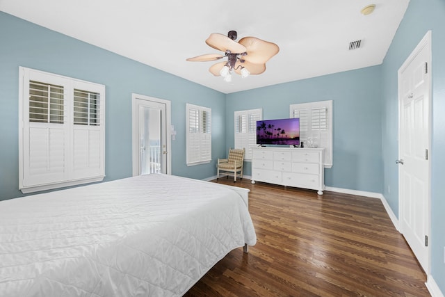 bedroom featuring ceiling fan, access to outside, visible vents, baseboards, and wood finished floors