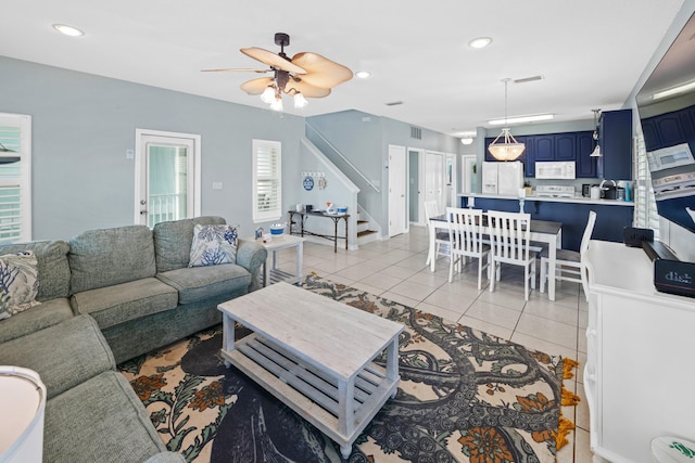 living room with recessed lighting, stairway, light tile patterned floors, ceiling fan, and visible vents