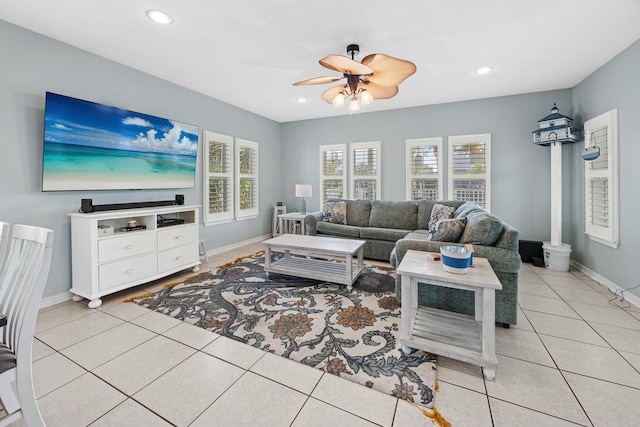 living area with baseboards, recessed lighting, light tile patterned floors, and ceiling fan