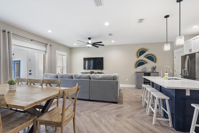 dining room featuring baseboards, ceiling fan, recessed lighting, and visible vents