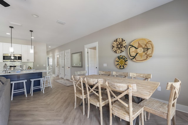 dining room featuring recessed lighting, baseboards, and visible vents