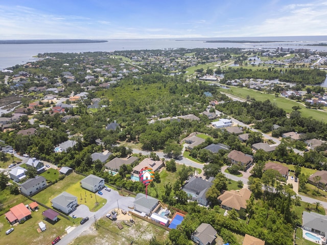 bird's eye view with a residential view and a water view