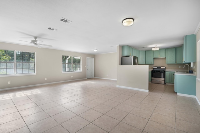 255 Brackin St, Crestview, FL 32539 - unfurnished living room featuring light tile patterned flooring, ceiling fan, visible vents, and baseboards