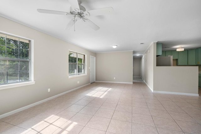 255 Brackin St, Crestview, FL 32539 - spare room with crown molding, light tile patterned flooring, baseboards, and a ceiling fan