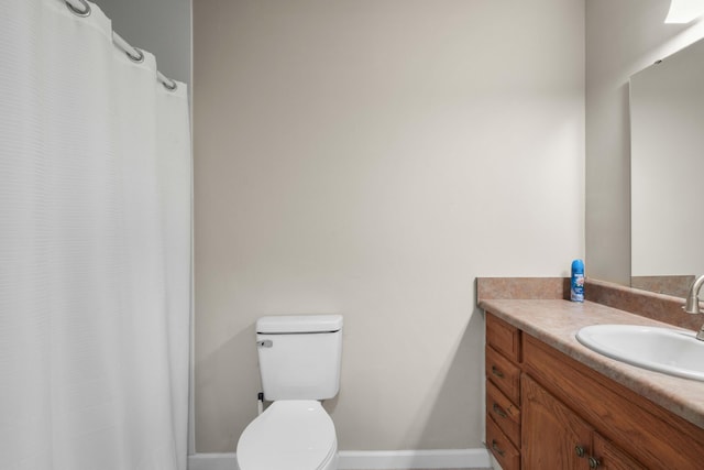 255 Brackin St, Crestview, FL 32539 - bathroom featuring vanity, baseboards, toilet, and a shower with curtain