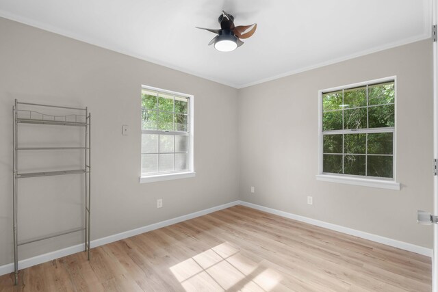 255 Brackin St, Crestview, FL 32539 - unfurnished bedroom with baseboards, multiple windows, and light wood finished floors