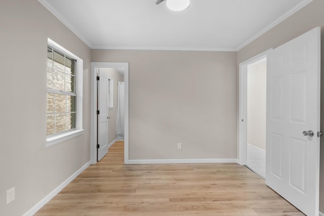 255 Brackin St, Crestview, FL 32539 - unfurnished bedroom featuring baseboards, ornamental molding, and light wood finished floors