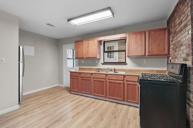 255 Brackin St, Crestview, FL 32539 - kitchen with light countertops, stainless steel appliances, a sink, and light wood finished floors