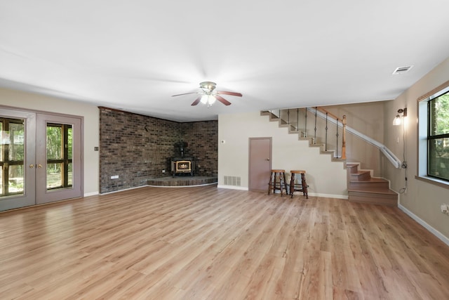 255 Brackin St, Crestview, FL 32539 - unfurnished living room featuring visible vents, plenty of natural light, stairway, and light wood-type flooring