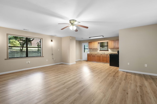 255 Brackin St, Crestview, FL 32539 - unfurnished living room with baseboards, light wood-style flooring, ceiling fan, and visible vents