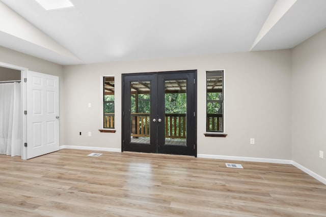 255 Brackin St, Crestview, FL 32539 - entryway with french doors, visible vents, baseboards, lofted ceiling, and light wood-style floors