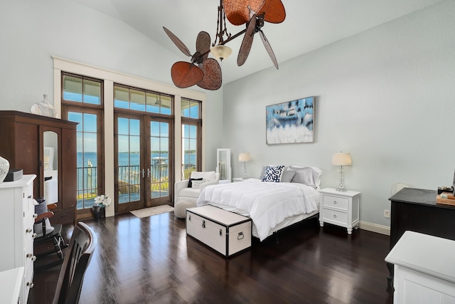 bedroom featuring dark wood-style flooring, lofted ceiling, access to exterior, baseboards, and french doors