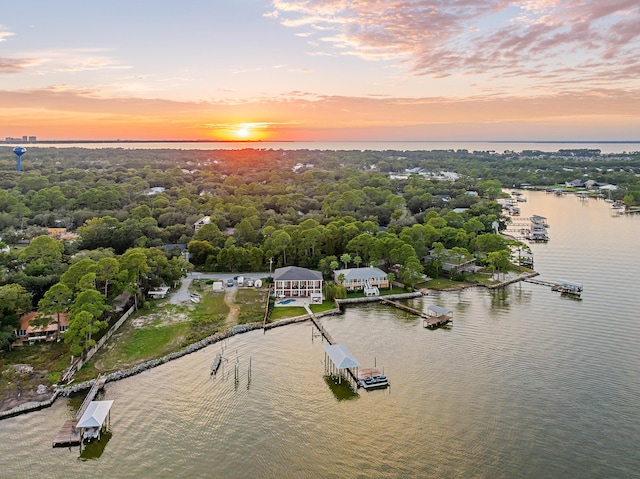 aerial view at dusk with a water view