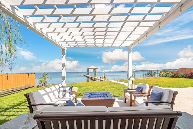 view of patio / terrace featuring fence, an outdoor living space with a fire pit, boat lift, a water view, and a dock