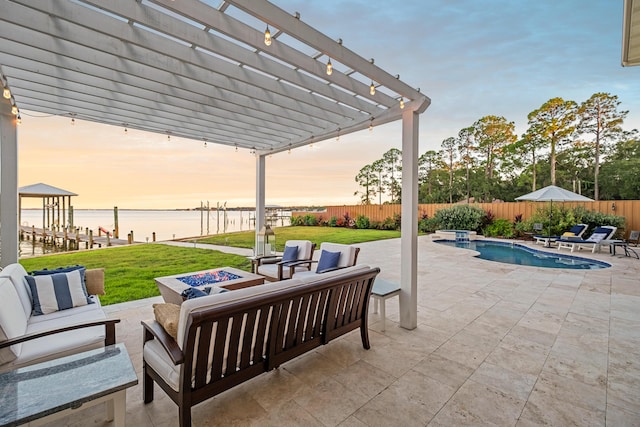view of patio / terrace with a pergola, an outdoor living space, a water view, and a fenced backyard