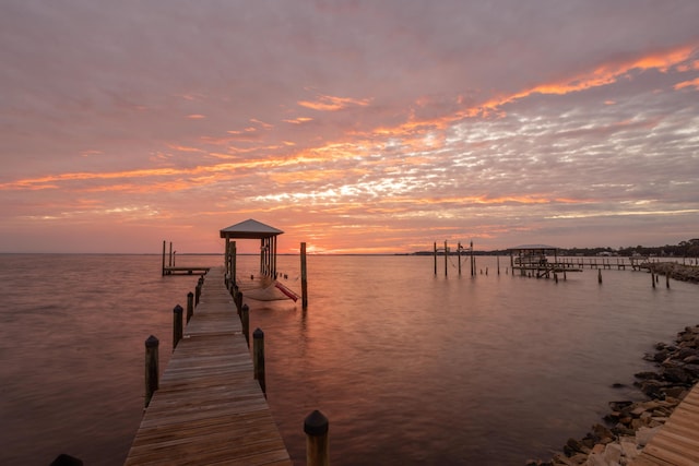 view of dock featuring boat lift and a water view