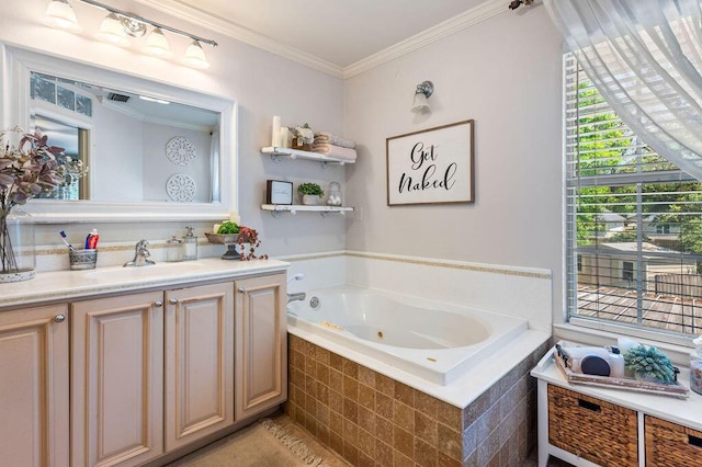 bathroom featuring a jetted tub, vanity, and ornamental molding