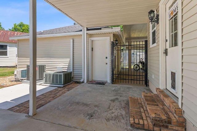 view of patio / terrace with central AC and a gate