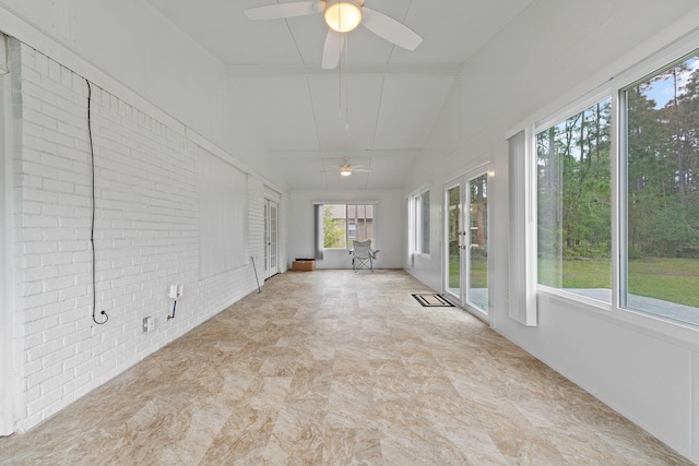 unfurnished sunroom with french doors and brick wall