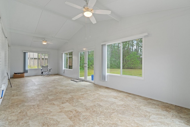 spare room featuring lofted ceiling with beams, ceiling fan, and french doors