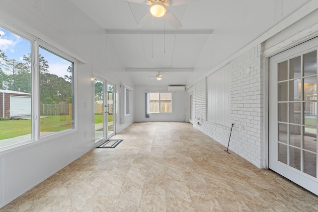 unfurnished sunroom with beam ceiling, french doors, and a wall mounted air conditioner
