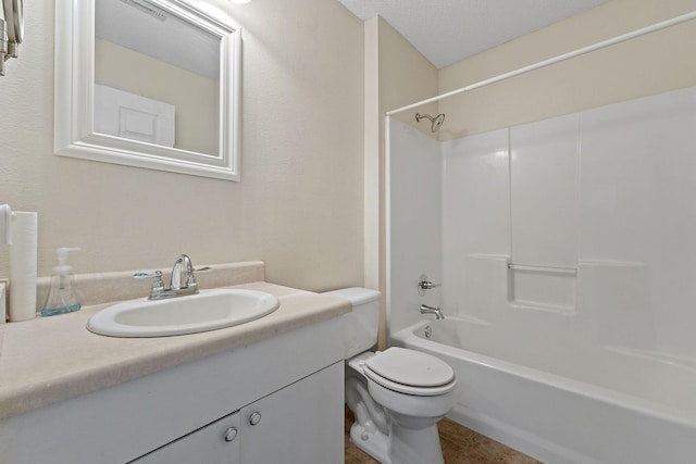 bathroom with toilet, bathtub / shower combination, and vanity