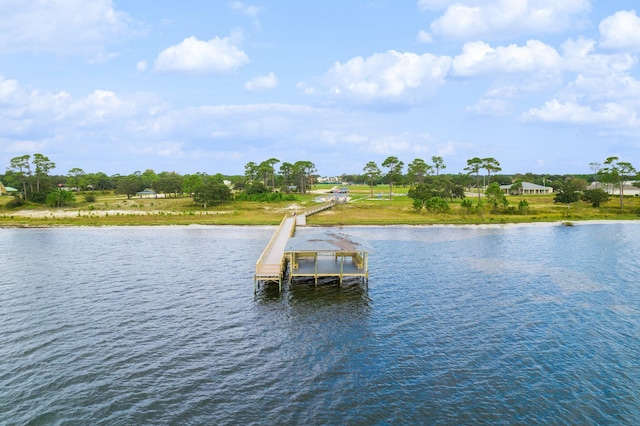 view of dock with boat lift and a water view