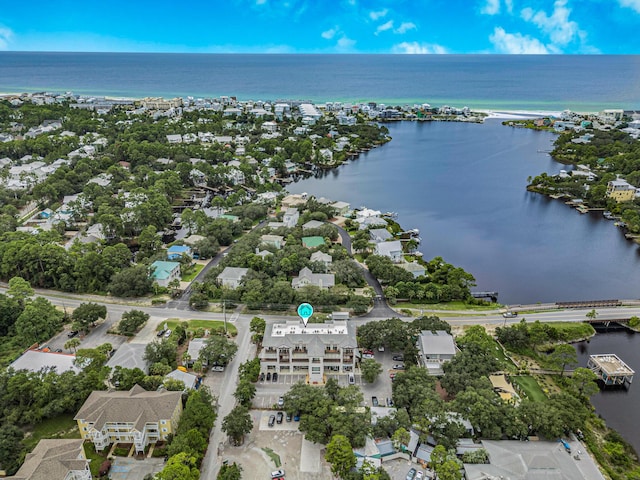 drone / aerial view featuring a residential view and a water view