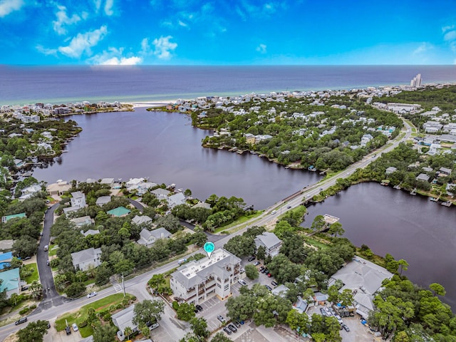 drone / aerial view with a residential view and a water view