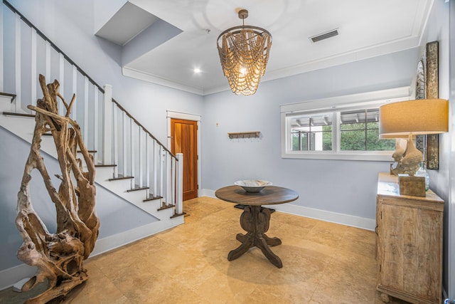 foyer featuring a chandelier, stairs, visible vents, baseboards, and ornamental molding