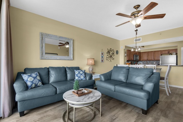 1160 Scenic Gulf Dr Unit 204A, Miramar Beach, FL 32550 - living area with a ceiling fan, visible vents, and light wood finished floors