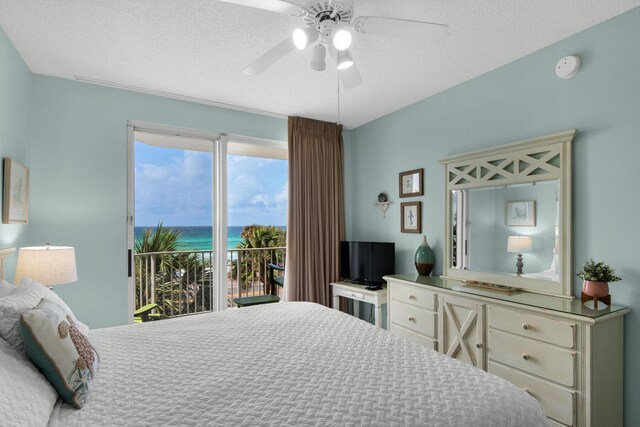 1160 Scenic Gulf Dr Unit 204A, Miramar Beach, FL 32550 - bedroom featuring ceiling fan, access to outside, and a textured ceiling