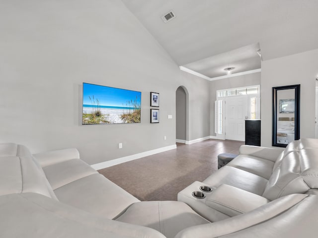 living area featuring arched walkways, plenty of natural light, baseboards, visible vents, and high vaulted ceiling