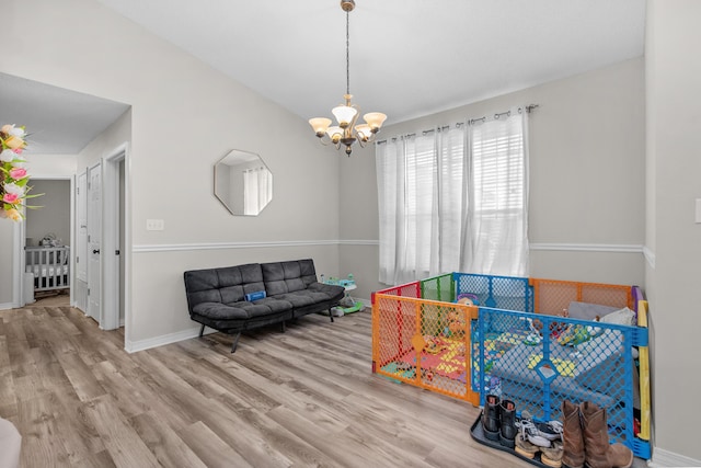 1207 Jefferyscot Dr, Crestview, FL 32536 - recreation room with a notable chandelier, wood finished floors, and baseboards